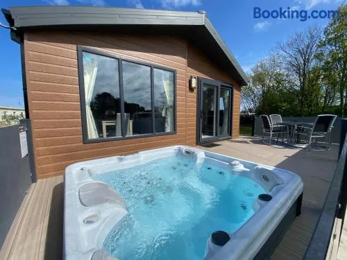 The Retreat 1 - Hot tub Lodge, pet friendly, WiFi & bed linen- Golden Palm Resort - Meadow Lakes Caravan & Lodge Hire - Image 1