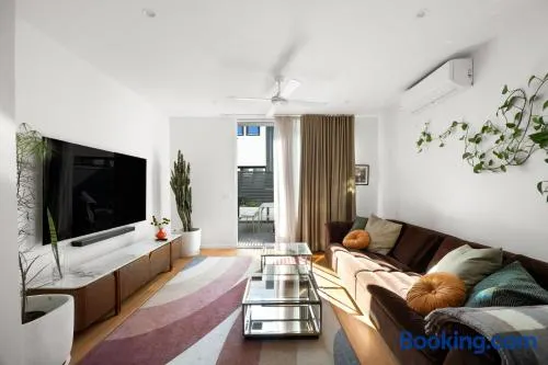 3BR Townhouse with Private Terrace & Double Garage - Image 1