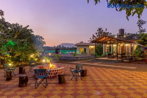 SaffronStays Apricus Farm - 4BHK Veg Estate with Pool, Yoga & Garden - Image 1