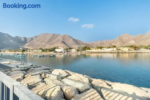 Luxury 3BR Retreat with Assistant Room and Private Pool, Breathtaking Mountain Views, Close to Fujairah Beautiful Beaches, Al Dana Island, Fujairah by Deluxe Holiday Homes - Image 1