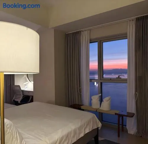 Modern 1BR with Balcony Facing Infinity Pool Manila Bay Sunset Near Airports OKADA Solaire MOA - Image 1