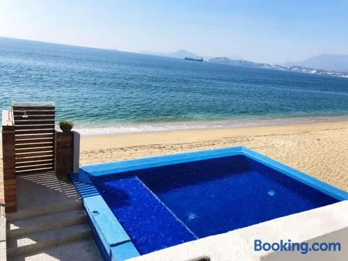 INCREIBLE DEPARTAMENTO A PIE DE PLAYA EN MANZANILLO, COMPLETAMENTE NUEVO - Image 1