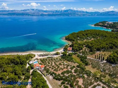 Beachfront House Mir Brač near Supetar with pool and jacuzzi - Image 1