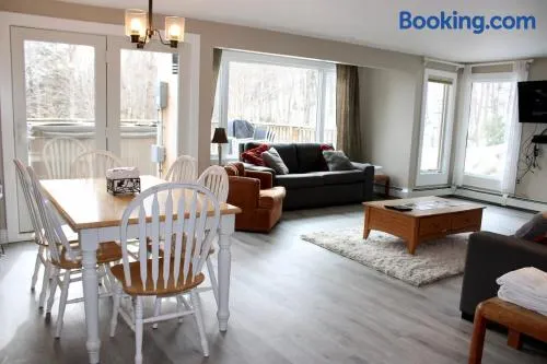 Trailside Village #5 - Slopeside 1BR with Hot Tub and Sauna, Ski In Ski Out on Great Eastern Trail - Image 1