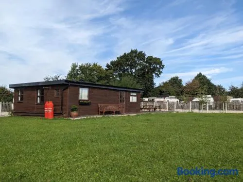 Log cabin with secure garden - Image 1