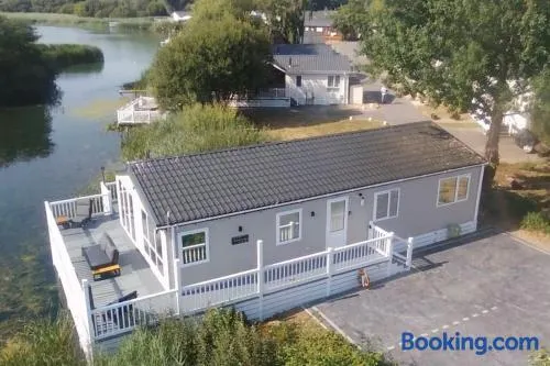 Chichester Lakeside Holiday Park Lakefront Lodge - Image 1