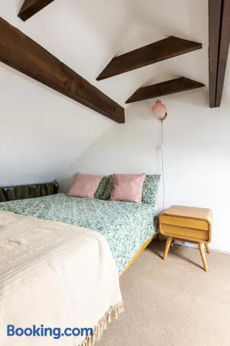 En-suite with double bed on mezzanine and desk in family home - Image 1