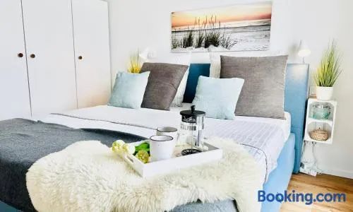 Surfbude, Olpenitz - moderne Ferienwohnung in direkter Strandnähe mit eigenem Eingang, Sauna, Kaminofen, Balkonterrasse und Parkplatz - Image 1