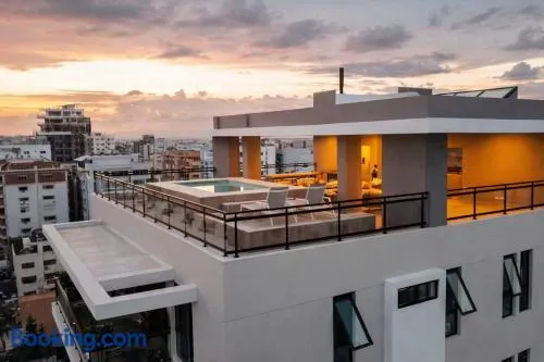 Modern apartment with pool and rooftop, centrally located - Image 1