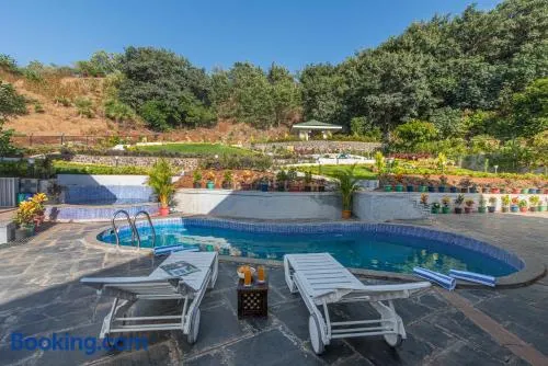 SaffronStays Caramelo - a private heated swimming pool villa with Jacuzzi nestled amidst beautiful landscaping and gardens in Lavasa - Image 1