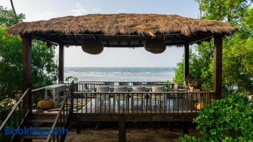 SaffronStays Stella Maris Beach House - 5BR pet-friendly beachfront estate with yoga pavilion, luxury tents & private Redi Beach access - Image 1