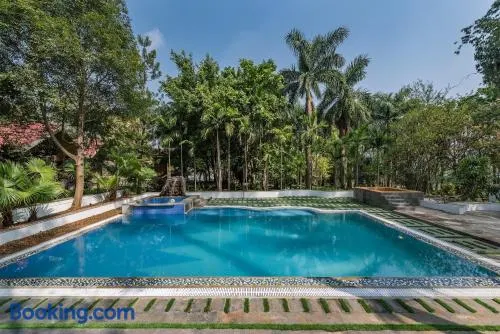 SaffronStays Foresta by the Lake - 6BR veg-only pool estate with lake views, lawns, gazebo & sports court in Kamshet - Image 1