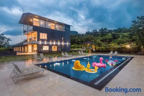 SaffronStays Sundowner - 8BR Morbe-view villa, grand pool, outdoor bar, gazebo, TT & pool table, rain dance, award-winning - Image 1