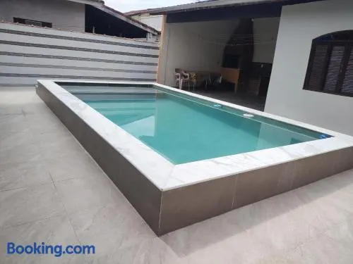 Casa piscina com ozônio churrasqueira perto da praia - Image 1