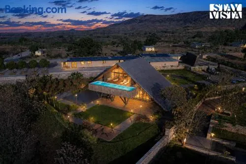 StayVista at Sunset Crest with Infinity Pool, Lawn - Image 1