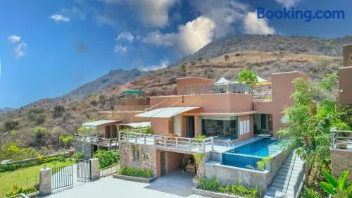 SaffronStays Moringa WishingTree - 3-BR villa near Nathdwara with pool, lawn and hillside views - Image 1