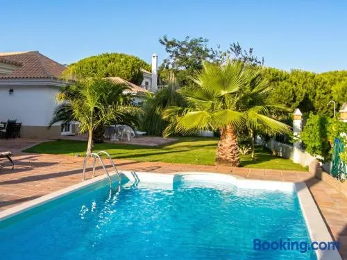 Elegant Villa in Nuevo Portil with Shared Pool - Image 1