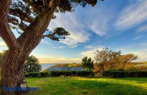 Flat 1 High Tide House, Mortehoe - beautifully designed ground floor flat with sea views and garden - Image 1