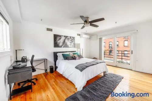 Modern 3BR Townhouse with Private Rooftop & Parking Minutes to NYC - Image 1