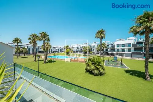 Oasis Beach Sunscape Penthouse, Private rooftop and resort wellness by OYOOSTAYS - Image 1