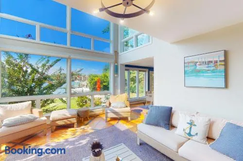 Dog-friendly riverfront home with dock, 2 balconies, waterside patio, & grill - Image 1