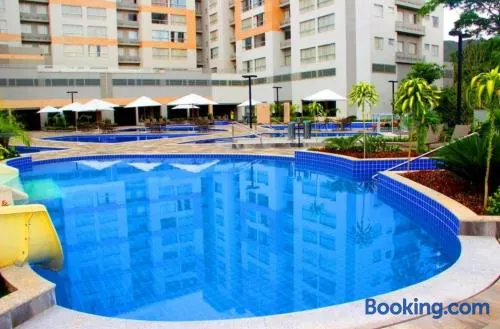 Flat Park Veredas- Vista Piscinas - Acesso ao Rio - 11 Piscinas - Próximo ao Hot Park - A5 - Image 1