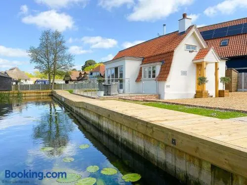 Dutch Cottage sits in its own basin off the River Bure in Horning - Image 1