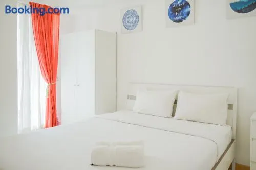 Spacious and Elegant 2BR M-Town Serpong Apartment By Travelio - Image 1