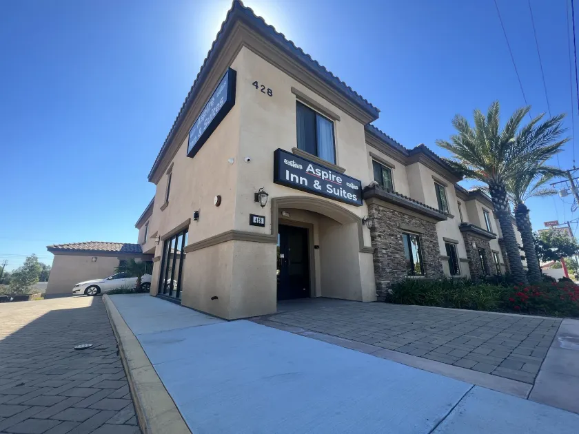 ASPIRE INN & SUITES Orange - Image 1