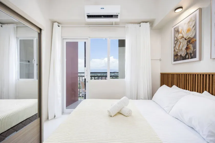 Elegant Wood-accent Studio With Balcony - Image 1