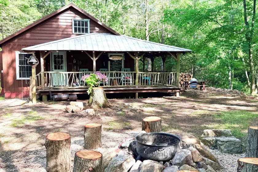 Cabin on Mountain Stream, Surrounded by Forest - Image 1