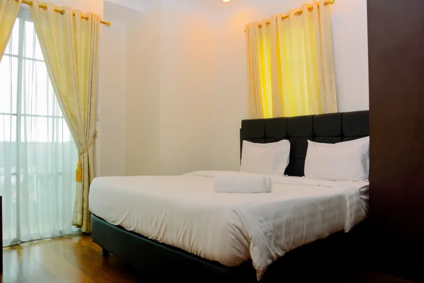 Modern 2BR at The Belleza Apartment By Travelio - Image 1
