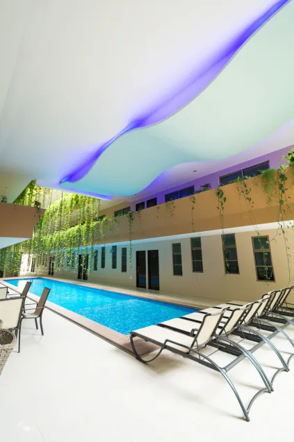 Palmarena Rooms & Residences - Long Stay Comfort with Parking, Sauna, Gym & Pool - Steps from 5th Avenue - Image 1