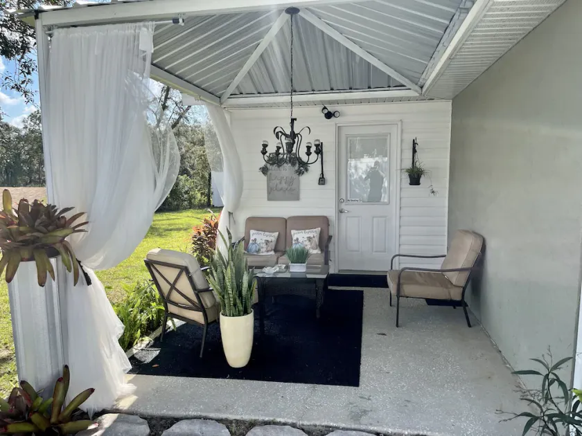 Modern studio apartment with covered outside seating area - Image 1