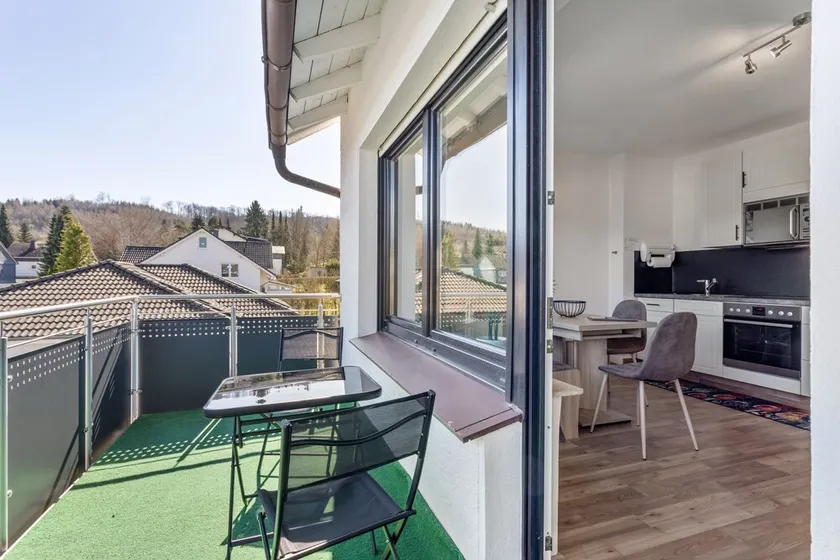 Upstairs Apartment with Private Balcony and Internet - Image 1