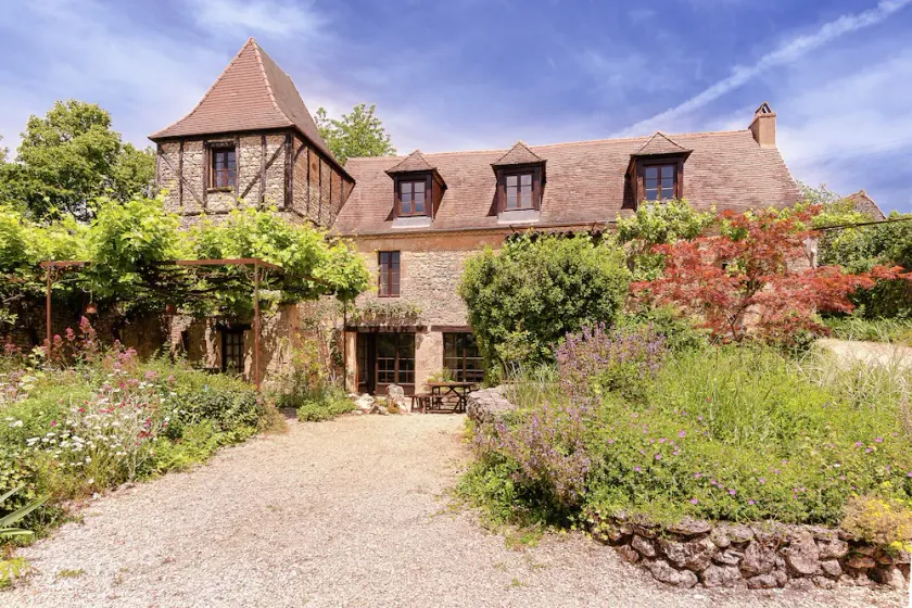 A romantic hamlet with lush gardens on a hill - Image 1