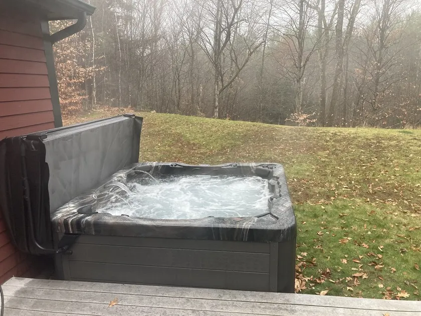Private hot tub with seasonal pellet smoker - Image 1