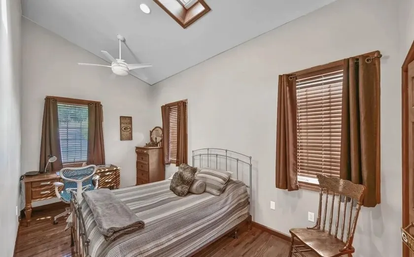 The spacious lakefront house features kayaks and a boat ramp. - Image 1