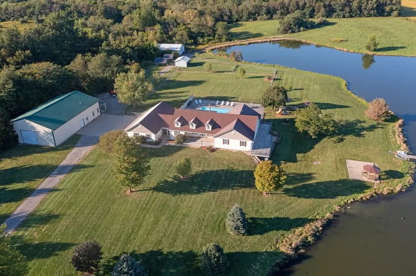 Beautiful Country Setting with Heated Inground Pool and Stocked Pond - Image 1