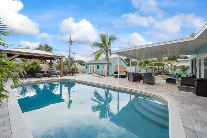 Pool house with separate guest house included, heated pool, easy walk to beach! - Image 1