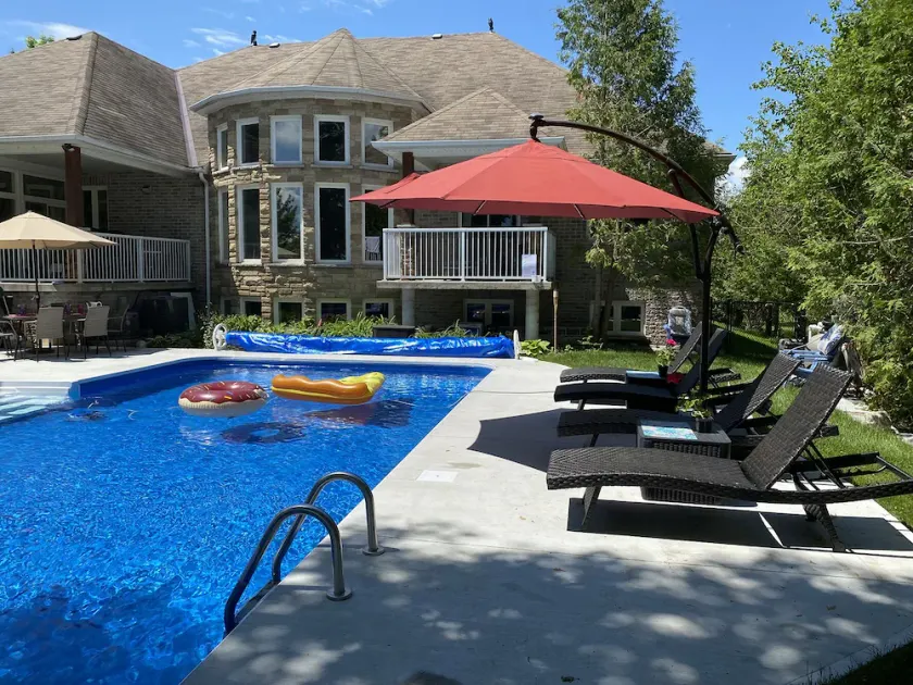 Luxury 7000 sq ft Lakefront Home with Hot Tub, Sauna, and Pool - Image 1