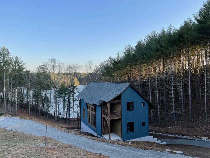 Lake front home with dock in a small cove with a beach. - Image 1