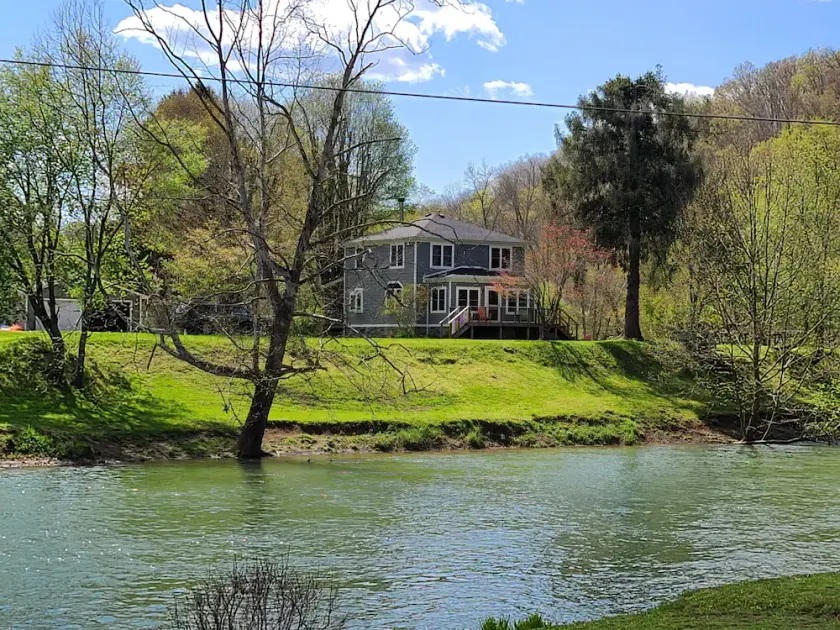 Charming, remodeled farmhouse on the river to kayak with a hot tub & a firepit!! - Image 1