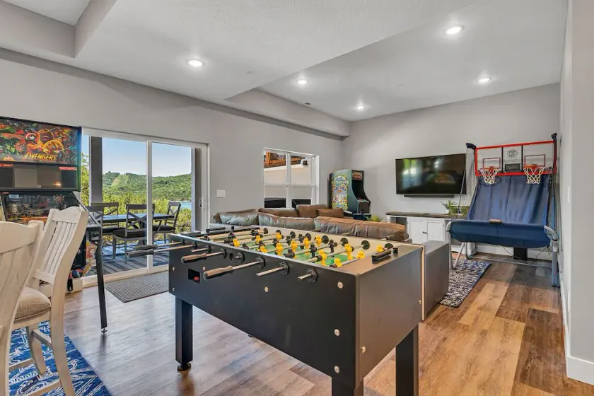 Stunning Lakefront Stay with Golf Cart, Private Hot Tub, Packed Game Room & Free Tickets Included! - Image 1