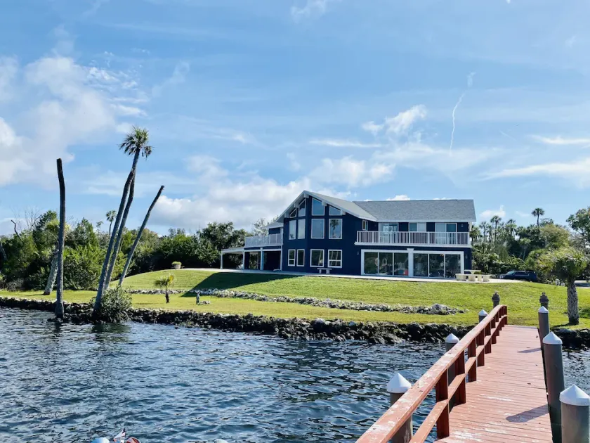 Spacious Riverfront Retreat. Sunset views with private Dock, Sleeps 12. - Image 1