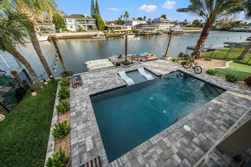 Waterfront home w/ direct gulf access + pool + hot tub + activites! - Image 1