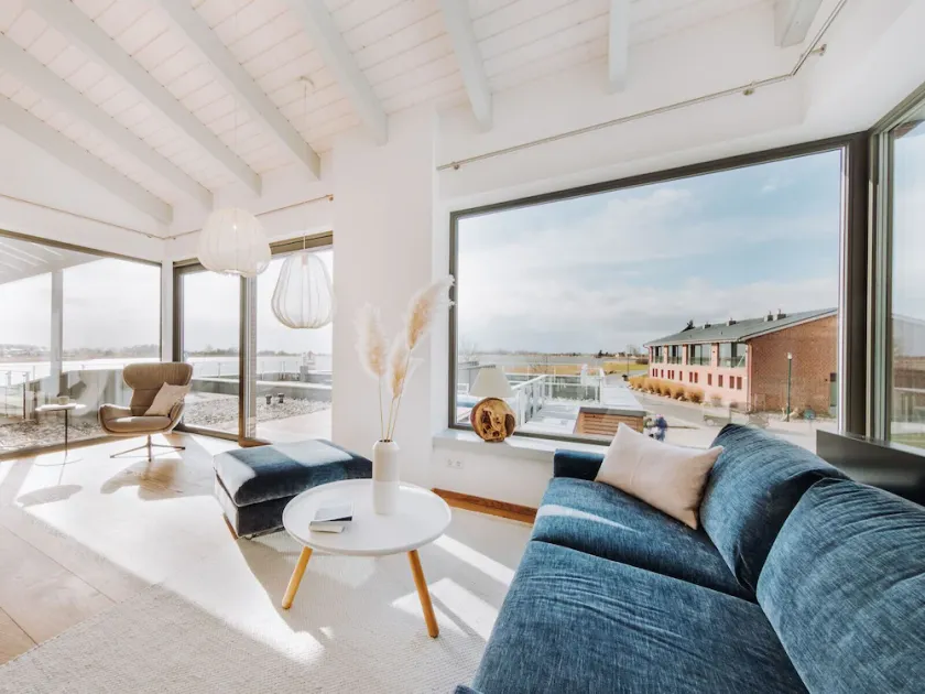 FISCHER:IN Vacation Rental in Ummanz. Panoramic sauna with a stunning view of the water. Spacious sun deck for relaxing vacation moments. The ultimate in sleeping comfort with box-spring beds. Insect Screen - Image 1