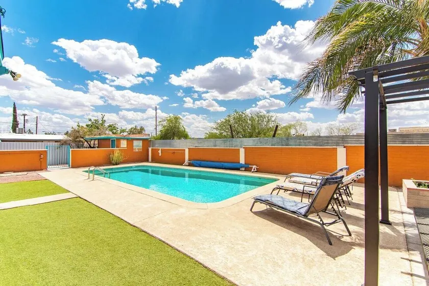 This centrally located 3 bedroom 2 bathroom features a full size pool and electric vehicle charging on site. - Image 1