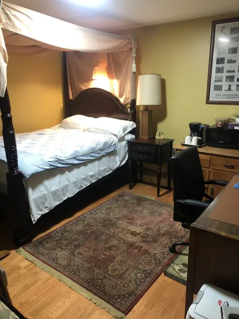 A secluded bedroom with a private full bathroom - Image 1