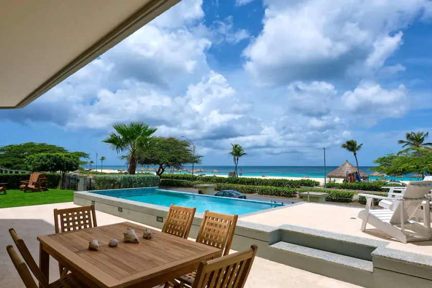 Walk to Eagle Beach – Exclusive 6BR Beachfront Condo with Private Pool & Jacuzzi - Image 1